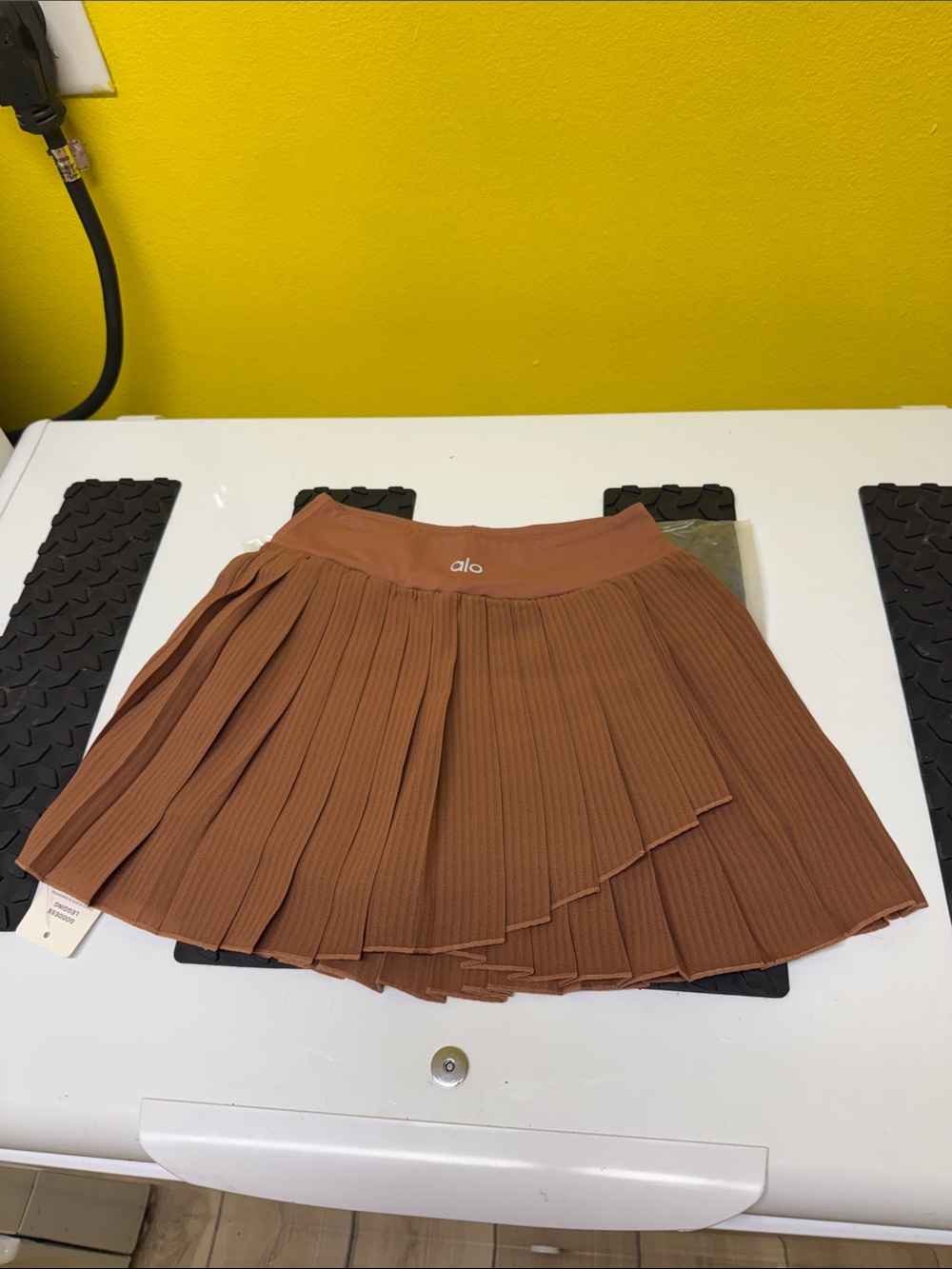 ALO Yoga Pleated Skater Skirt in Rust Brown